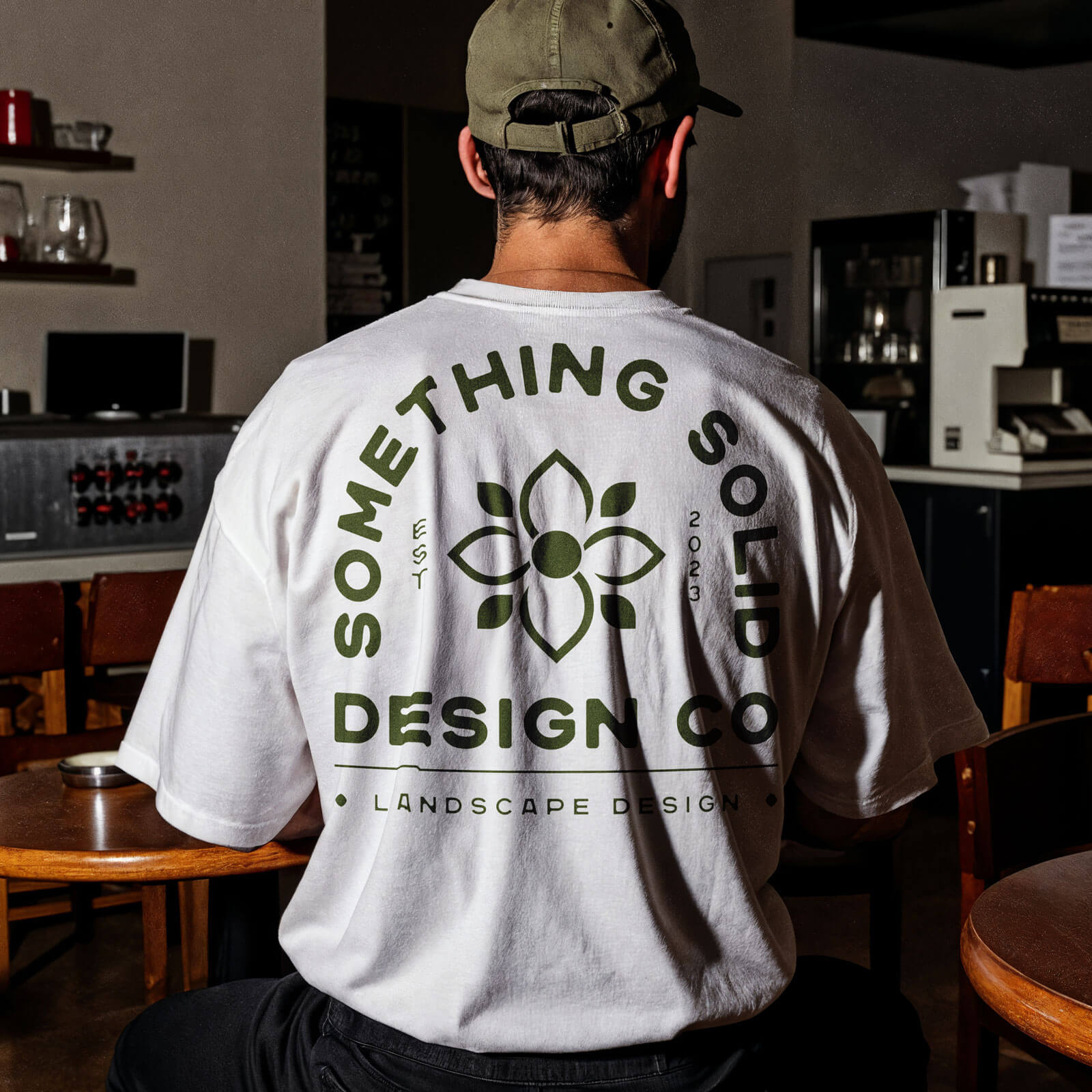 A mockup of the "Something Solid Design Co." logo on a teeshirt
